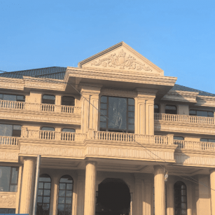 驻马店黄金麻别墅外墙干挂石材效果示例