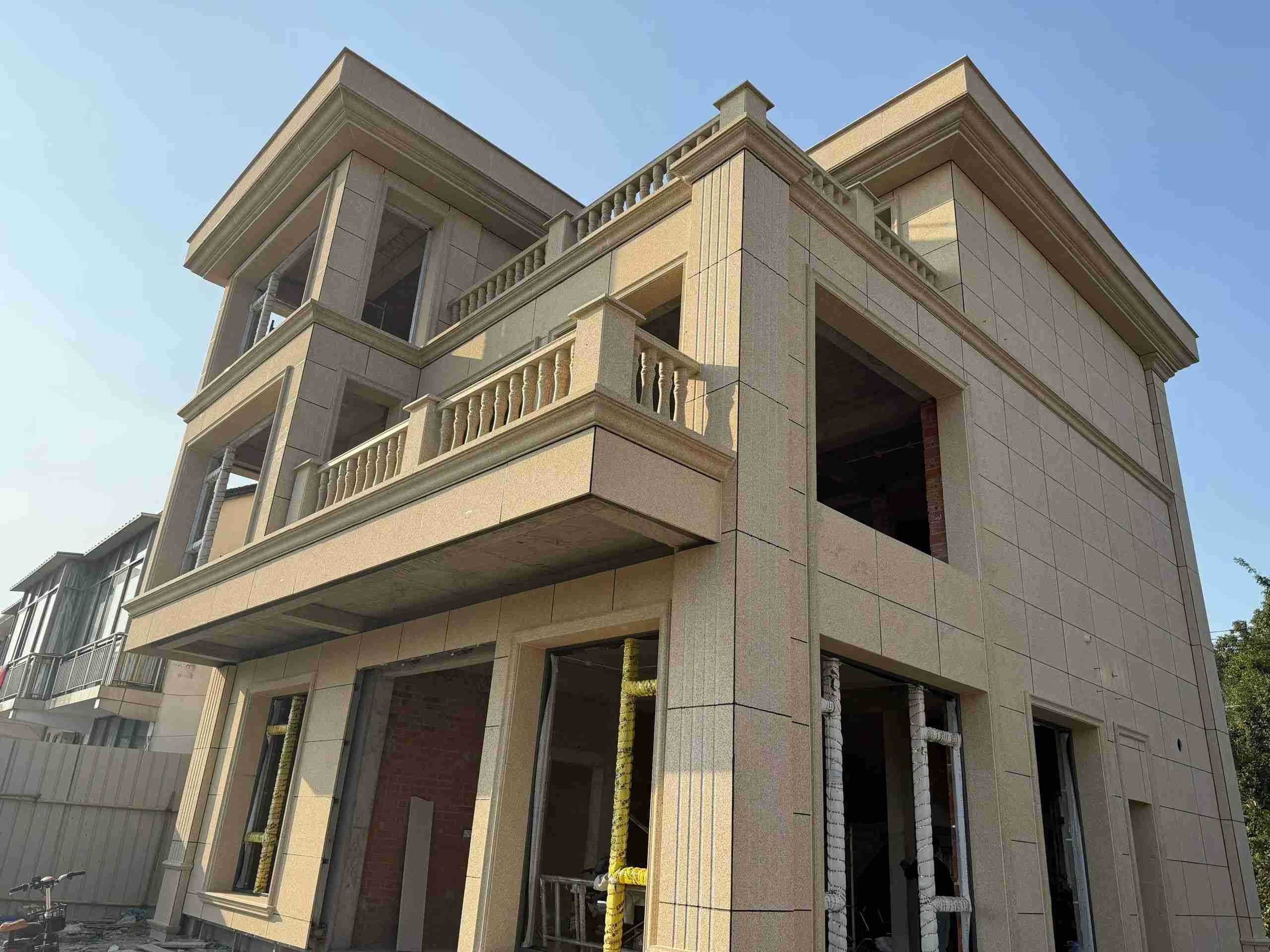 驻马店 黄金麻花岗岩石材荔枝面外墙干挂效果展示